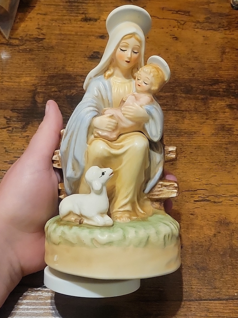 The Virgin Mary holding the infant Jesus with a lamb